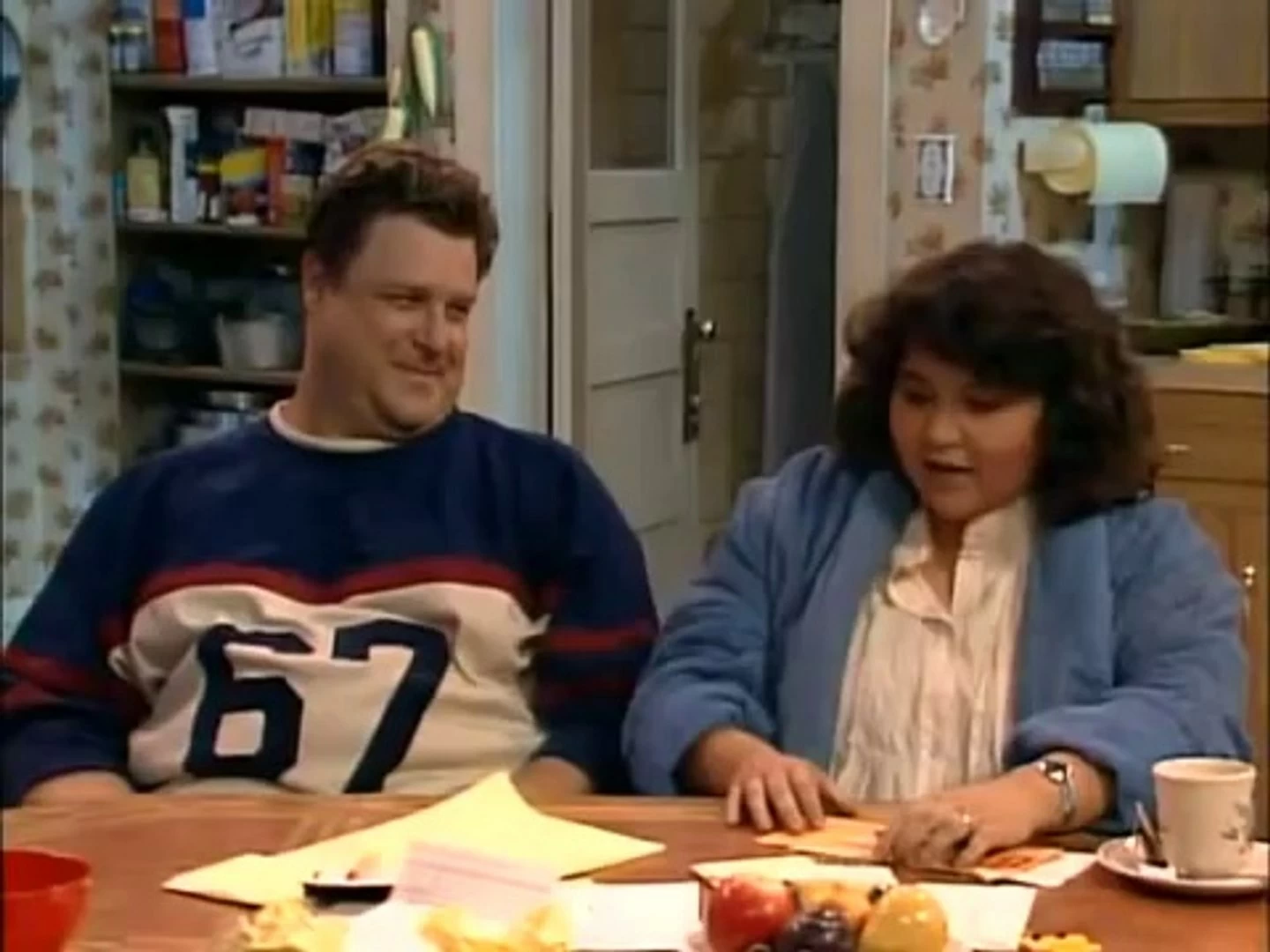 Roseanne and Dan Conner try to decide what to do with unexpected money.
