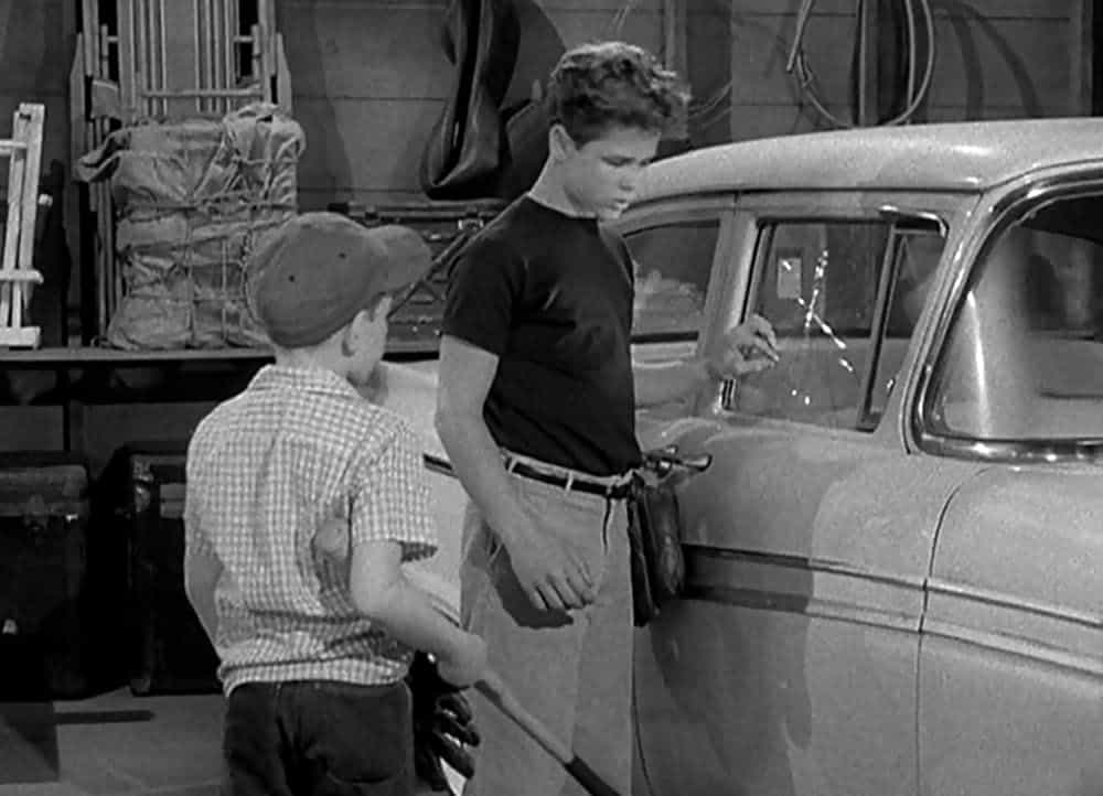 Wally and Beaver struggle to figure out how to pay to get their parents' car window replaced after an errant baseball smashes it.
