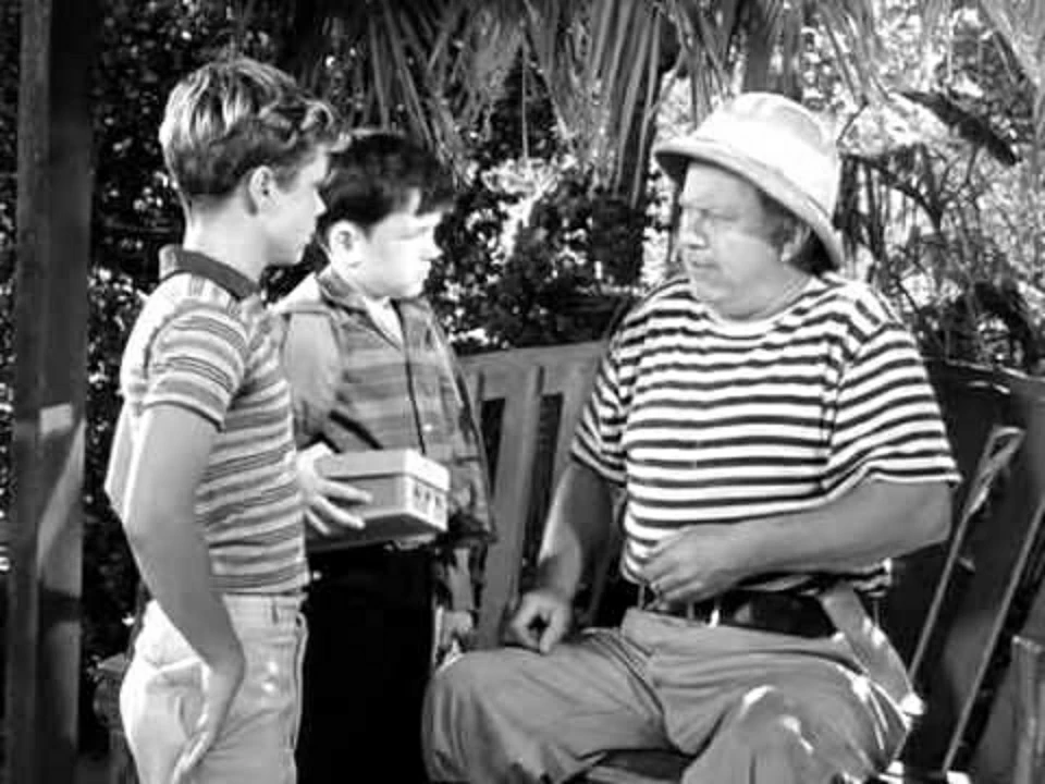 Proving that times were different back in the 1950s, Captain Jack (Edgar Buchanan) teaches Wally and the Beaver how to take care of a baby alligator.