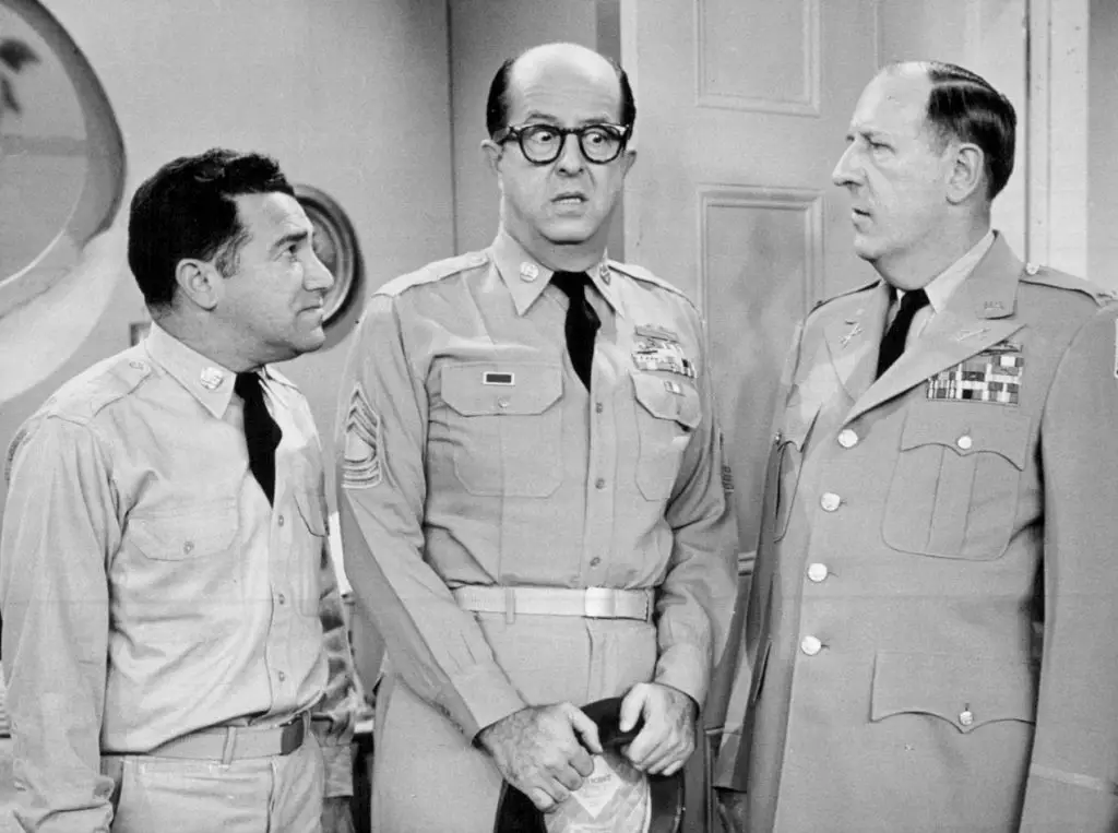 Phil Silvers, as Sgt. Bilko, with his a couple of his castmates, Billy Sands, as Pvt. Dino Papparelli, and Paul Ford, as Colonel John T. Hall.
